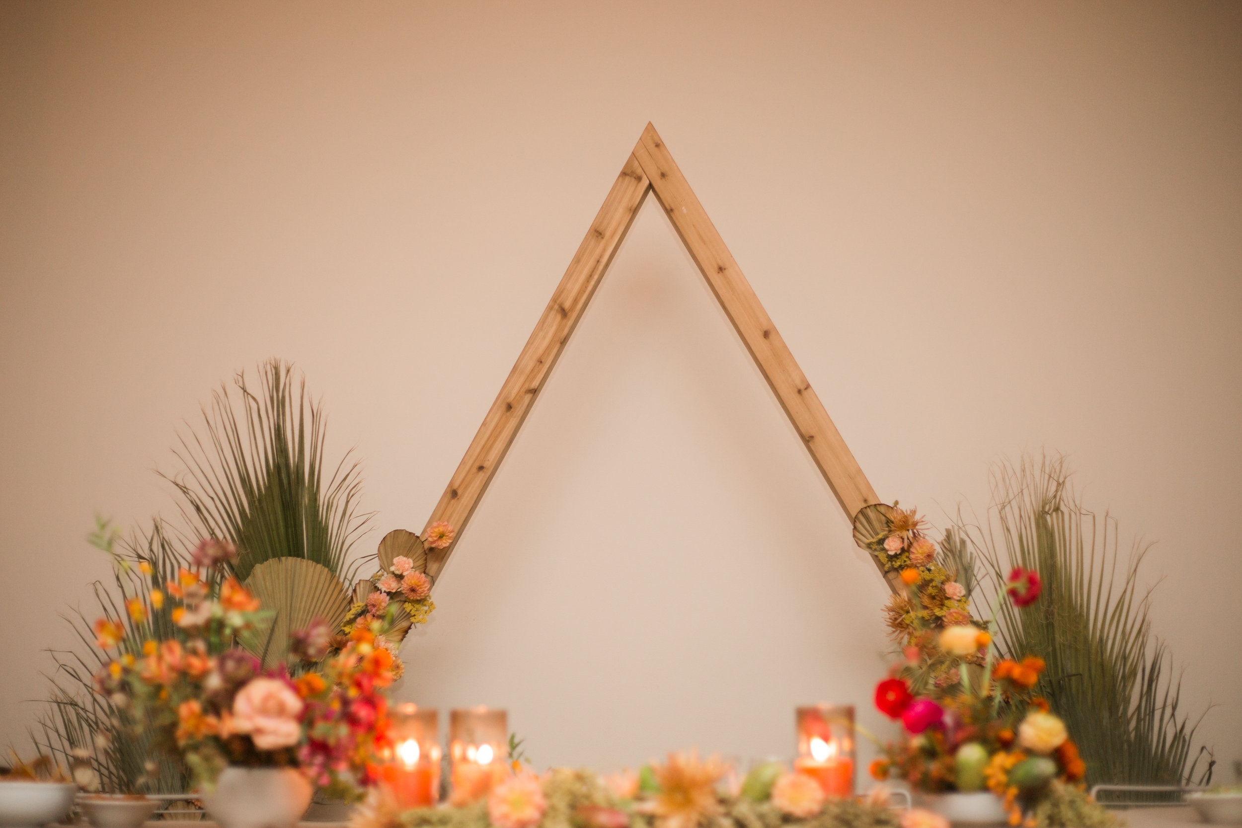 Desert inspired florals and triangle arch at Ace Hotel Palm Springs